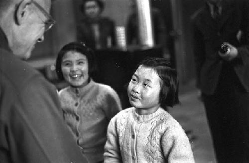 Portrait of general and young girl smiling at each other