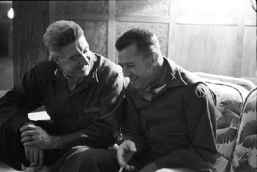 Portrait of soldiers sitting on couch conversating