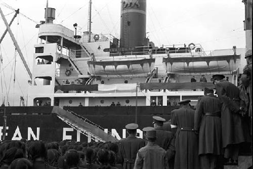 Soldiers on standby watching boat depart 3