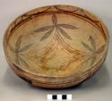 Pottery bowl--diameter 10", shallow, red base, rest light brown, with brown and