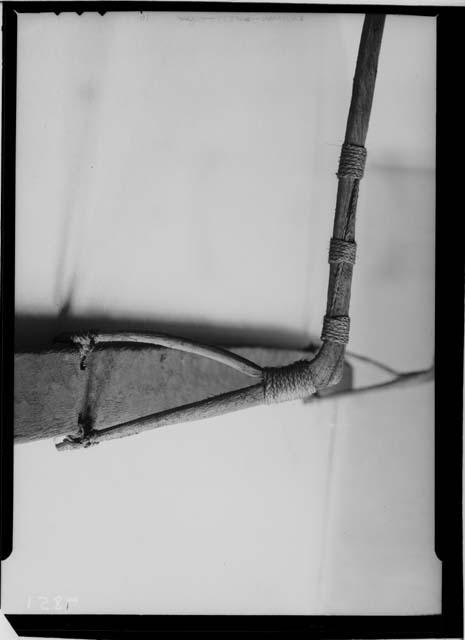 Close-up of outrigger of model canoe