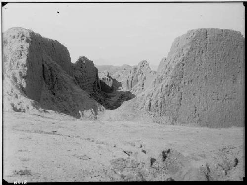 Narrow passageway running between two sections of the O' Donovan group. Tomb of the Bishop in background.