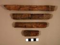 Wood fragments, possibly charred, mended with glue
