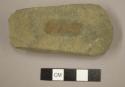 Ground stone, celt with flat sides and beveled end