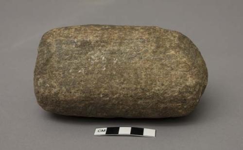 Granite stone, one side flattened, used to grind something