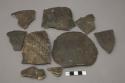 Ceramic sherds, body & base, incised and plain, some mended.