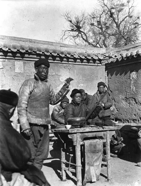 Ballad singer and man playing erhu, temple fair, Kuei-hua [Hohhot]