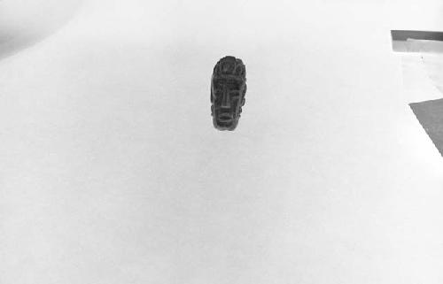 Fragment of bead or pendant, human head