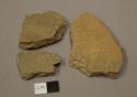 Earthenware body sherds, shell tempered, two undecorated, one cord impressed