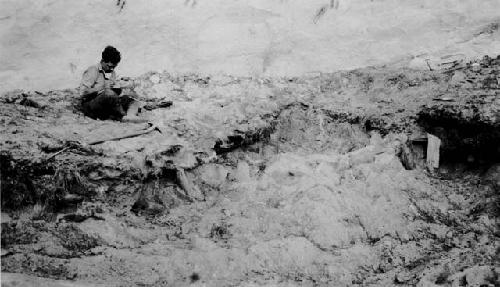 Cist 1 partially excavated, showing posts