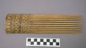 Bamboo comb--black filled incisions; probably modelled after shortland+