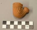 Pamplin red clay pipes with raised mold made linear design which runs from bowl