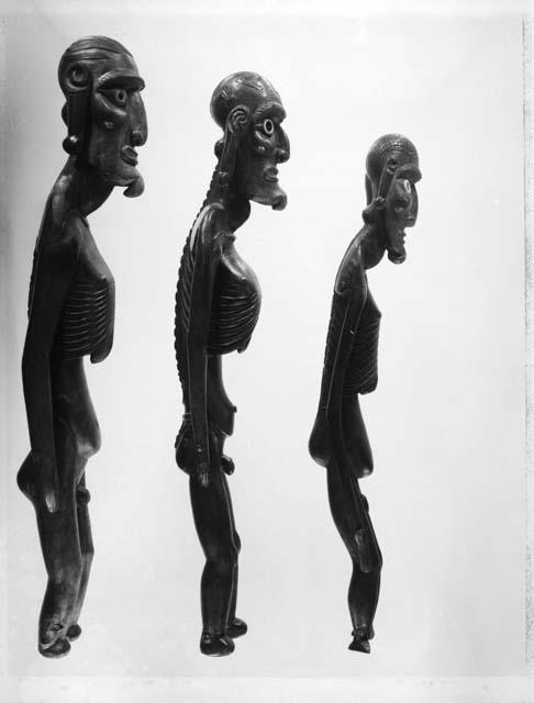 Carved wooden human figures - male