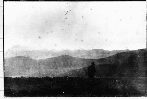 Man standing by mountains