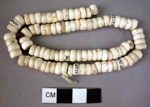 Beads in string, natrolite