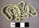 String of beads, faience, small, 426 total, found on body