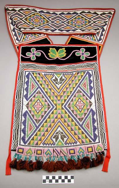 Beaded cloth shoulder pouch.
