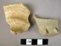 2 decorated potsherds (1 with incised decoration, 1 with impressed decoration)