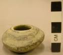 Black on white pottery miniature jar