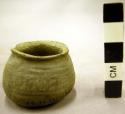 Black on white pottery miniature jar