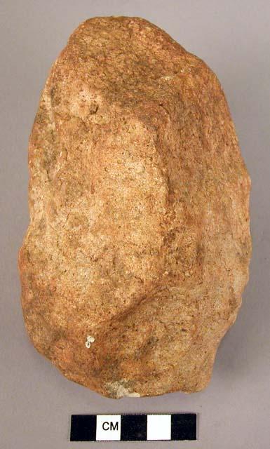 Heavily rolled, crudely worked quartzite fist axe, possibly an unfinished specim