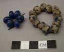 Glass beads, round, blue and blue & brown "eyes" on white & gray