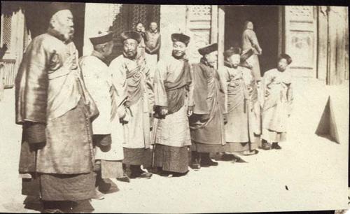 Chinese men standing in line