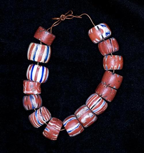 Glass, beads. red with white and blue streaks