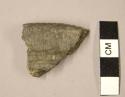 Ceramic sherd, incised lines top edge of and below rim, punctation inside