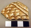 Indented corrugated potsherds with plain corrugation applied diagonally to the a