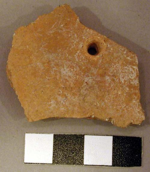 Ceramic body sherd, perforated, undecorated redware