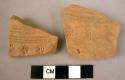 2 potsherds - red, stamped and incised