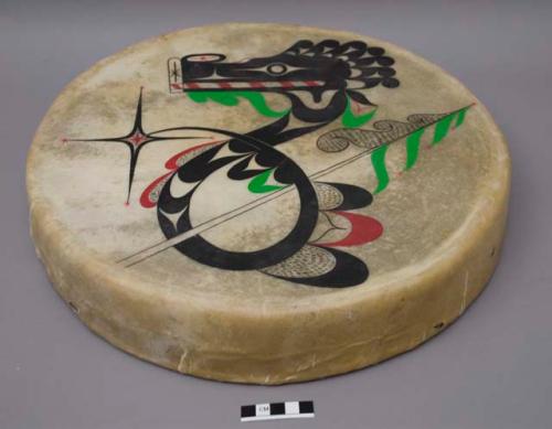 Drum painted with serpent-line figure, inscribed "Serpents / & / Songs" and "Spencer / McCarty 87 / [glyph]"