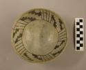 Small black and white pottery bowl