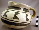 Black on white pottery handled jar