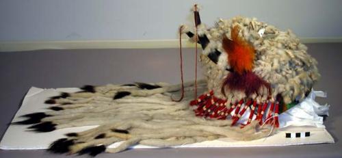 Bead banded white fur headdress with antler horns and metal decoration