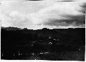 Landscape; mountain range; houses; road