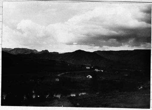 Landscape; mountain range; houses; road