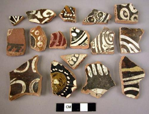 37 potsherds - white on dark brown glazed (local)