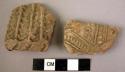 2 potsherds - light colored, moulded relief