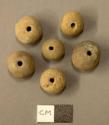 Spherical fired clay beads