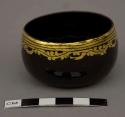 Small black lacquer bowl with gold design