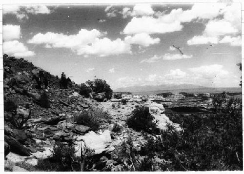 Men on horseback; mountains in backdrop