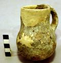 Undecorated pottery pitcher