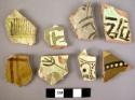 11 potsherds - lead glaze, cream brown and green painted patterns (local)