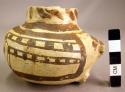 Jeddito black-on-yellow pottery handled jar