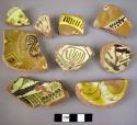 15 base potsherds - glazed, painted with white, yellow and dark brown (local)