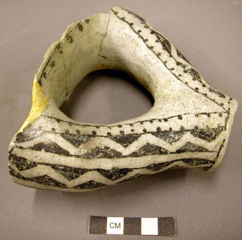 Fragment of black on white pottery jar--double spout, single orifice