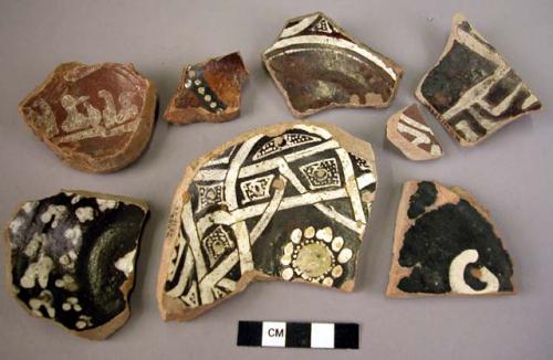 12 base potsherds - white on dark brown glaze (local)