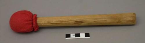 Drumstick; wood with red cloth-wrapped head